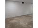 Spacious basement with painted white brick walls and concrete floors at 1002 Hemlock Dr, Shelby, NC 28150