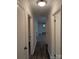 A long hallway with wood floors and white trim, illuminated by recessed lighting at 1002 Hemlock Dr, Shelby, NC 28150
