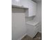 Functional kitchen area with white cabinetry, countertops, and ample storage space at 1002 Hemlock Dr, Shelby, NC 28150