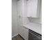Bright kitchen featuring white cabinets, modern countertops, and stainless steel dishwasher at 1002 Hemlock Dr, Shelby, NC 28150