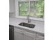 Kitchen sink featuring stainless steel sink, faucet and quartz countertops, offering an efficient area at 1002 Hemlock Dr, Shelby, NC 28150