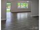 Open living area with new flooring and large windows, showcasing the bright and airy space at 1002 Hemlock Dr, Shelby, NC 28150