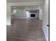 Open living area showcases hardwood floors, a brick fireplace, and recessed lighting at 1002 Hemlock Dr, Shelby, NC 28150