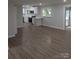 Spacious open-concept living area featuring an updated kitchen and hardwood flooring at 1002 Hemlock Dr, Shelby, NC 28150