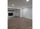 Spacious living area featuring hardwood floors, recessed lighting, and a brick fireplace at 1002 Hemlock Dr, Shelby, NC 28150