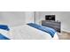 Bedroom featuring plush carpet, neutral wall color, and television at 1101 Mona Dr, Charlotte, NC 28206