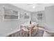 Bright dining area with seating for four, large windows, and a comfortable atmosphere at 1101 Mona Dr, Charlotte, NC 28206