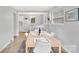 Charming dining area flowing into a kitchen with bar seating and updated appliances at 1101 Mona Dr, Charlotte, NC 28206