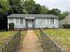 Charming single-story home featuring a well-maintained front yard and classic architectural details at 1101 Mona Dr, Charlotte, NC 28206
