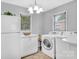 Open kitchen with laundry area featuring modern appliances, countertop, and ample space at 1101 Mona Dr, Charlotte, NC 28206