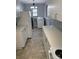 Well-lit kitchen with modern appliances and adjacent laundry area for added convenience at 1101 Mona Dr, Charlotte, NC 28206