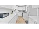 Modern kitchen with sleek countertops, white cabinets, and updated stainless steel appliances at 1101 Mona Dr, Charlotte, NC 28206
