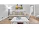 Cozy living room featuring a comfortable sofa, modern lighting, and beach-themed decor at 1101 Mona Dr, Charlotte, NC 28206