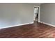 This open concept living room offers lots of space and features new vinyl floors at 1101 Mona Dr, Charlotte, NC 28206