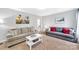 Cozy living room with comfortable sofas, a coffee table, and decorative artwork at 1101 Mona Dr, Charlotte, NC 28206