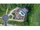 An aerial view displays a beautiful home with a pool, tennis court, and professionally landscaped backyard at 1118 Seminole Dr, Fort Mill, SC 29707