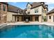 Beautiful backyard with a luxurious pool and covered patio for outdoor entertaining at 1118 Seminole Dr, Fort Mill, SC 29707
