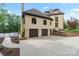 Home exterior features a basketball court, and a three-car garage with a retaining wall at 1118 Seminole Dr, Fort Mill, SC 29707