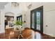 Bright, open foyer features hardwood floors, a decorative front door, and views into the dining room at 1118 Seminole Dr, Fort Mill, SC 29707