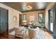 Well-appointed home office with rich wood floors, stylish lighting, and a comfortable seating area at 1118 Seminole Dr, Fort Mill, SC 29707