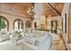 Open living area featuring high ceilings, a decorative chandelier, and a luxurious, comfortable sectional at 1118 Seminole Dr, Fort Mill, SC 29707