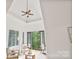Sitting area with ceiling fan features tall windows and balcony access at 1118 Seminole Dr, Fort Mill, SC 29707