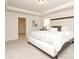 A bedroom featuring neutral walls, carpet floors, a tray ceiling, and an attached bathroom at 1119 Bellshill Dv, Indian Trail, NC 28079