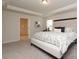 A bedroom featuring neutral walls, carpet floors, a tray ceiling, and an attached bathroom at 1119 Bellshill Dv, Indian Trail, NC 28079