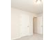 Neutral bedroom with carpet, two white panel doors, and cream walls is light and airy at 1119 Bellshill Dv, Indian Trail, NC 28079