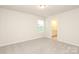 This bedroom has neutral walls, carpet floors, and an attached bathroom at 1119 Bellshill Dv, Indian Trail, NC 28079