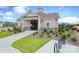 Beautiful community clubhouse with stone accents, manicured landscaping and clear blue skies at 1119 Bellshill Dv, Indian Trail, NC 28079
