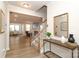 Bright foyer with hardwood floors, staircase, and view into the living and dining areas at 1119 Bellshill Dv, Indian Trail, NC 28079