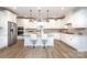 Modern kitchen featuring stainless steel appliances, a central island with seating, and ample natural light at 1119 Bellshill Dv, Indian Trail, NC 28079