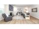 Cozy living room featuring hardwood floors, leather furniture, fireplace, and recessed lighting at 1119 Bellshill Dv, Indian Trail, NC 28079