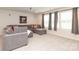 Basement living room with a sectional couch and plush carpeting, perfect for entertainment at 1119 Bellshill Dv, Indian Trail, NC 28079