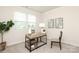 Well-lit office featuring a rustic desk, neutral walls, and a comfortable chair at 1119 Bellshill Dv, Indian Trail, NC 28079
