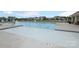 Enjoy a community pool with clear water, lounge chairs, and beautiful surrounding homes at 1119 Bellshill Dv, Indian Trail, NC 28079
