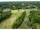 Aerial shot of the property, which is located on a golf course with views of the surrounding community at 1200 Firethorne Club Dr, Marvin, NC 28173