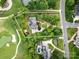 Expansive aerial view of the property nestled amongst lush landscaping, a golf course and charming neighborhood at 1200 Firethorne Club Dr, Marvin, NC 28173