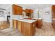 Gourmet kitchen with wood cabinetry, white countertops, and stainless steel appliances at 1200 Firethorne Club Dr, Marvin, NC 28173
