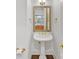Stylish powder room featuring a pedestal sink, ornate mirror, and elegant fixtures at 1200 Firethorne Club Dr, Marvin, NC 28173