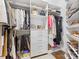 Organized walk-in closet with custom shelving, drawers, and hanging rods at 1200 Firethorne Club Dr, Marvin, NC 28173