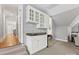 Attic bar area with cabinetry and small refrigerator, perfect for entertaining guests on another level at 1200 Firethorne Club Dr, Waxhaw, NC 28173