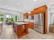 Bright kitchen featuring stainless steel appliances, light countertops, and wooden cabinetry at 1200 Firethorne Club Dr, Waxhaw, NC 28173
