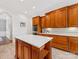 Spacious kitchen featuring wooden cabinetry, an island, and recessed lighting for a modern look at 1200 Firethorne Club Dr, Waxhaw, NC 28173