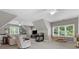 Spacious room with a wet bar, fireplace, and ample seating, perfect for relaxation and entertainment at 1200 Firethorne Club Dr, Waxhaw, NC 28173