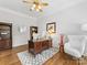 Cozy home office featuring custom desk and hardwood flooring at 1200 Firethorne Club Dr, Waxhaw, NC 28173