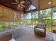 Relaxing sunroom with vaulted wood ceilings and outdoor views, perfect for enjoying the outdoors at 1200 Firethorne Club Dr, Waxhaw, NC 28173