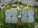 Aerial view of community tennis courts surrounded by lush greenery and parking area at 1200 Firethorne Club Dr, Waxhaw, NC 28173
