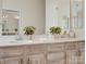 Bathroom featuring double sink vanity with updated fixtures and neutral countertops at 12632 Landing Green Dr, Charlotte, NC 28277